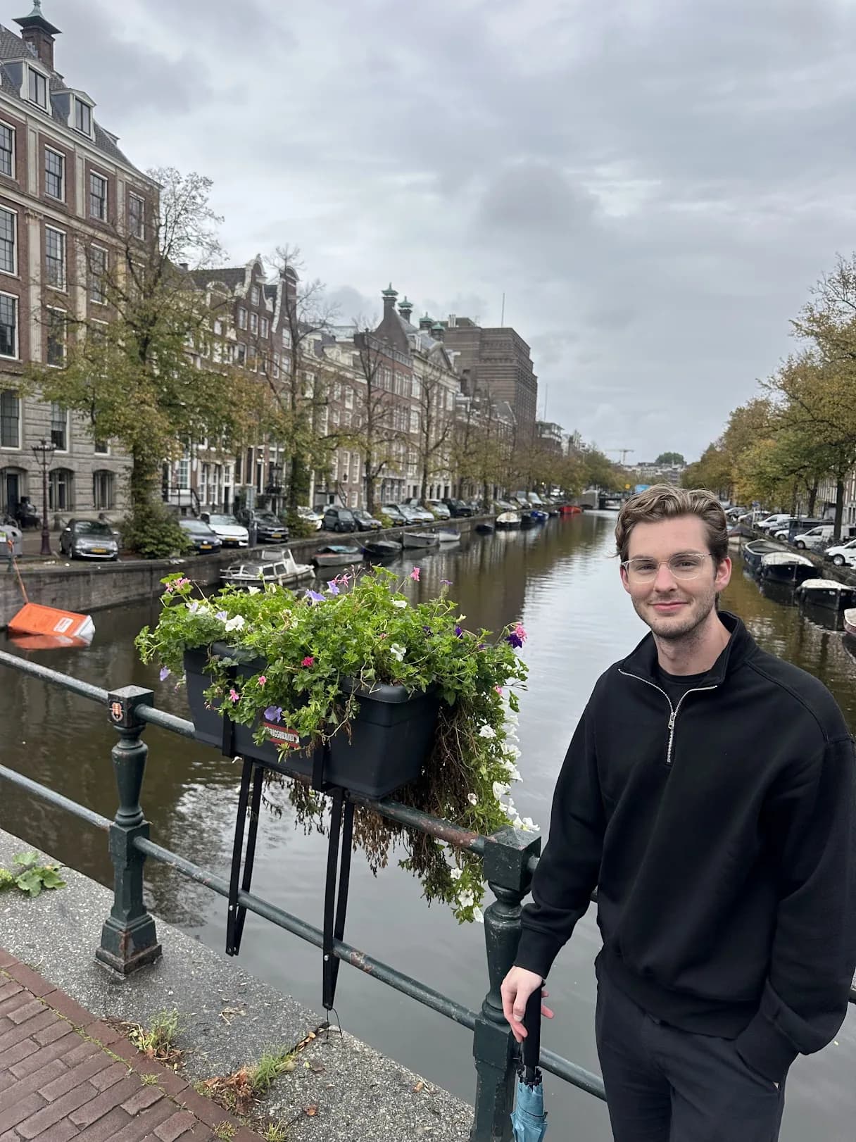 Zack Allen beside a canal in Amsterdam